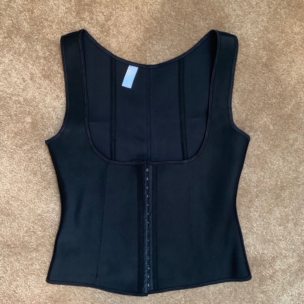 Black corset. Amazing build.